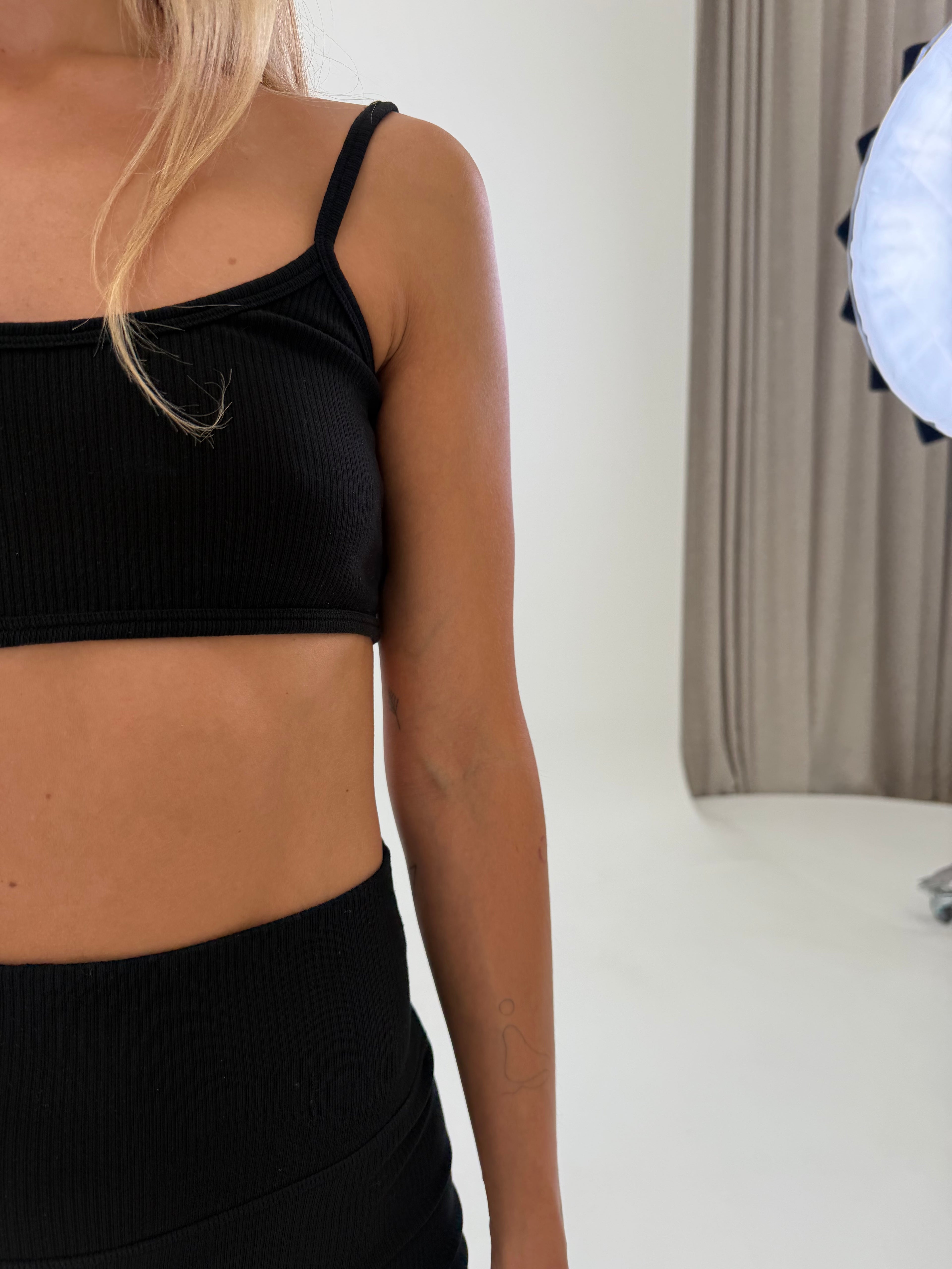 close up organic ribbed yoga bra black