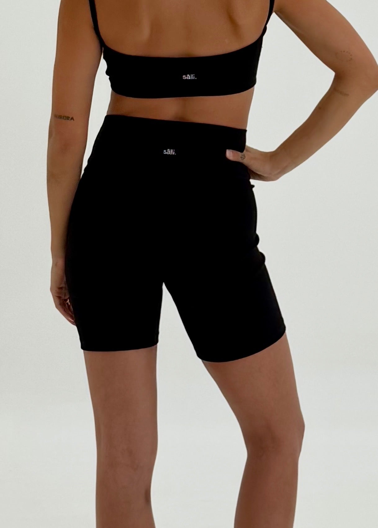 back view of ribbed black organic yoga set