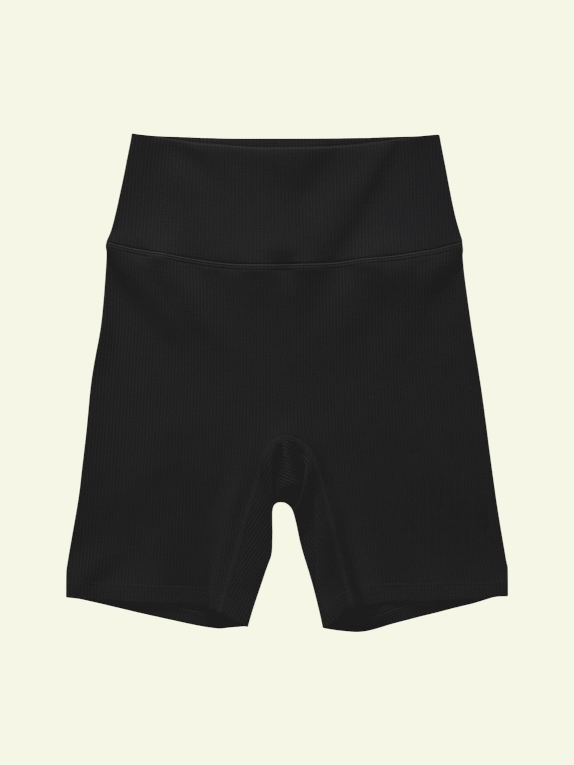 front of flat lay of black ribbed organic shorts